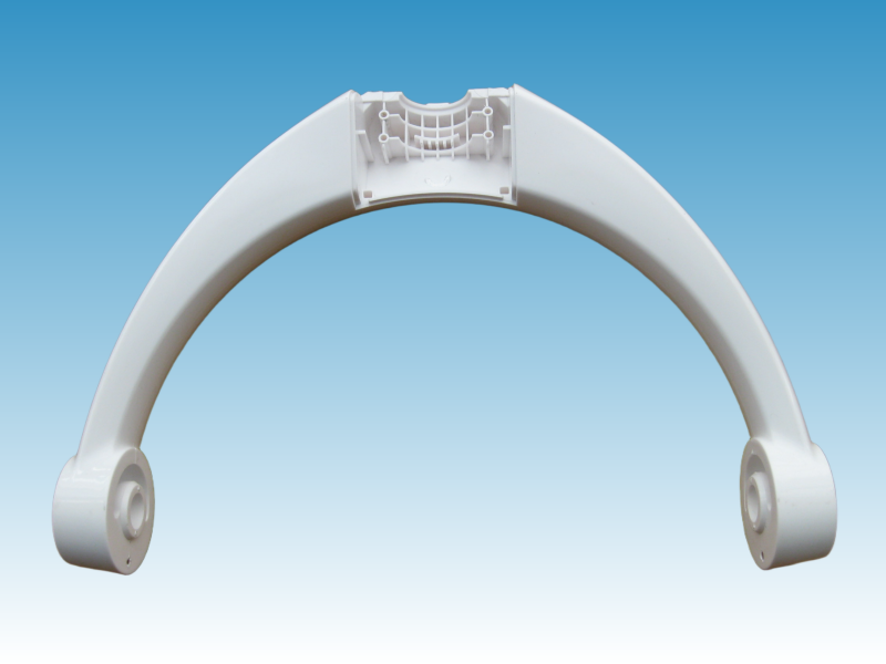 White curved part with mounting features and molded ribs